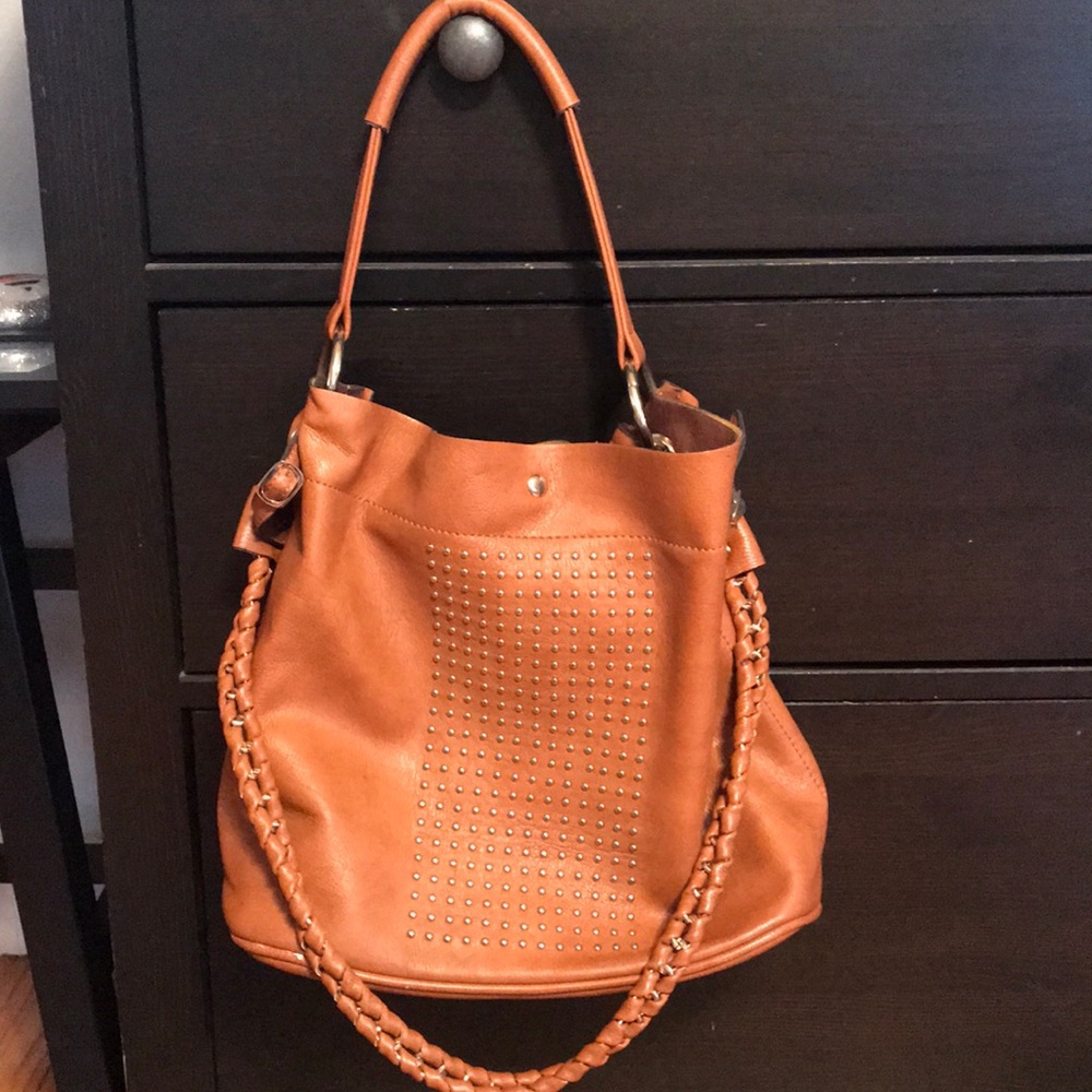 Tan satchel with gold detailing